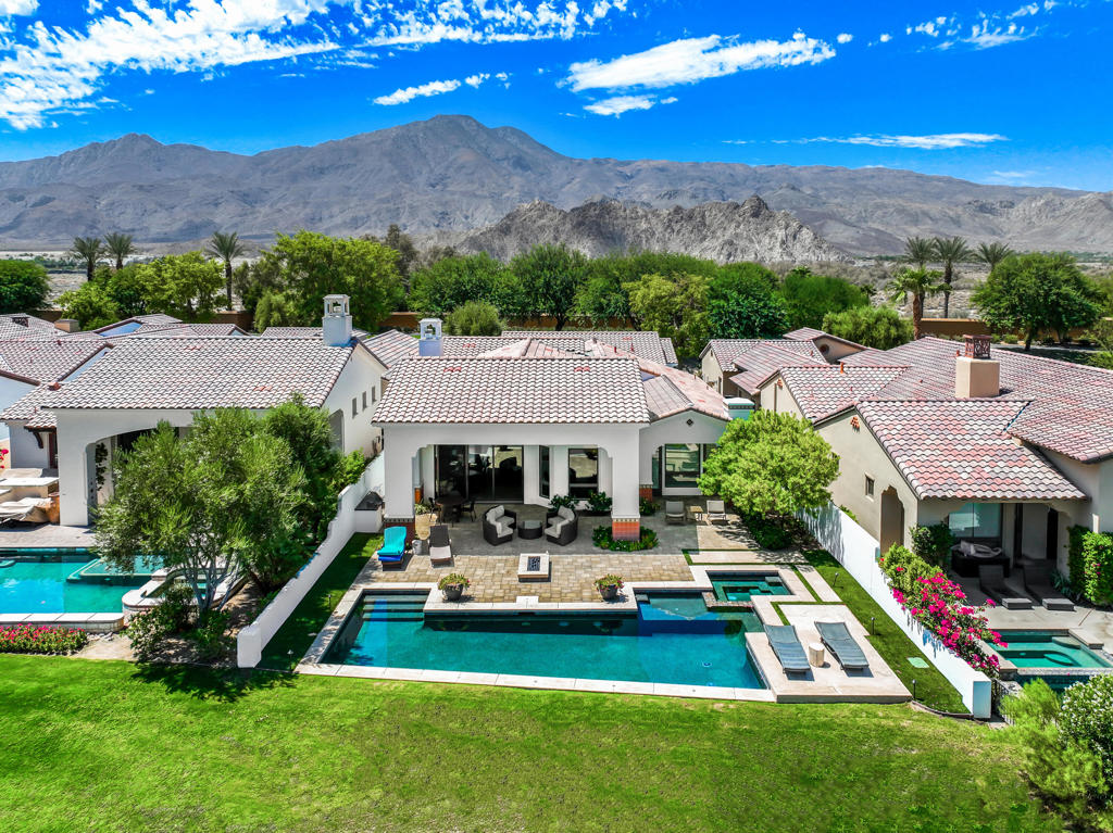 Experience the epitome of desert luxury living in this newly renovated oasis, nestled within the prestigious Andalusia at Coral Mountain. This captivating golf course home presents a harmonious blend of refined interiors and revitalized landscapes, offering an unparalleled desert lifestyle.Step inside this immaculate residence and discover a world of sophistication. Boasting three ensuite bedrooms, this home ensures comfort and privacy for both residents and guests. The interiors are adorned with fresh furnishings that radiate contemporary elegance.The heart of the home centers around a welcoming living room with a cozy fireplace, creating a focal point that exudes warmth and charm. Experience culinary excellence in the gourmet kitchen featuring quartz countertops, top-tier appliances, ideal for entertaining with style.Outdoor living is elevated to an art form in this residence. The sprawling patio beckons you to bask in the sun-drenched paradise, complete with a refreshing pool and spa. Enjoy outdoor dining by the inviting fire feature with numerous seating areas which provide an array of options for entertainment.Make this home your perfect vacation get away.