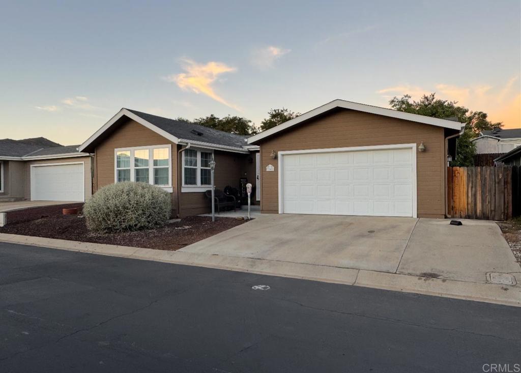 Welcome to this lovely 3-bedroom, 2-bath manufactured home on a permanent foundation, perfectly situated in the desirable all ages community of Woodcreek Estates. Inside, you’ll find a spacious layout with a large kitchen, a convenient laundry room, and a generous primary suite featuring a walk-in closet and a full bath complete with a soaking tub. Central air keeps the home comfortable year-round. Step outside to enjoy a covered patio and a mature avocado tree, ideal for relaxing or entertaining. Woodcreek Estates offers wonderful amenities including a pool, gym, community room, ample guest parking, the ability to rent an rv spaces, and well-maintained common areas—all in a peaceful neighborhood setting. Current space rent is $1,227 per month. Don’t miss the chance to call this beautiful home yours! Professional pictures coming soon.
