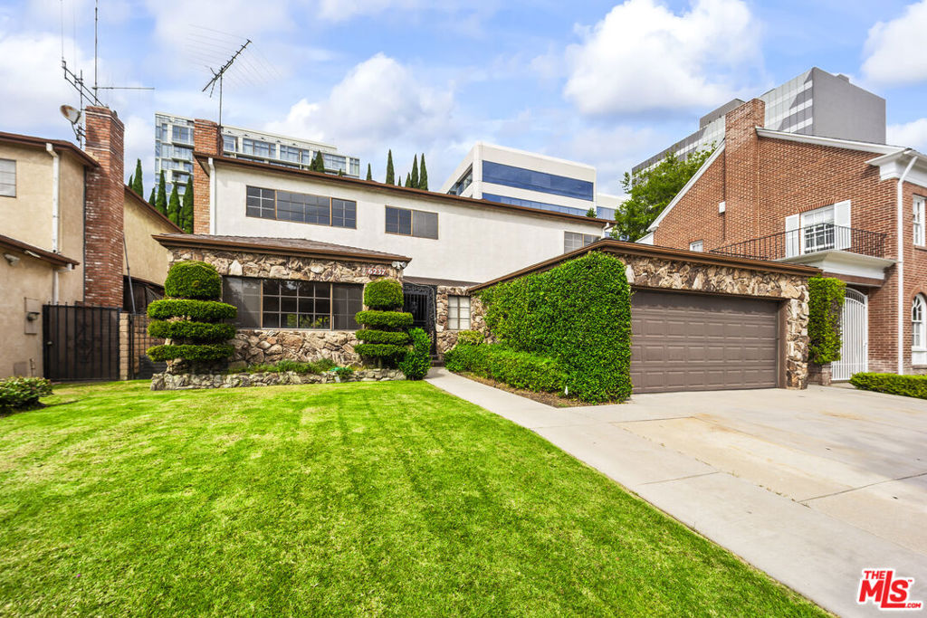 Welcome to this spacious 4-bedroom, 3-bathroom lease offering 3,099 sq ft of comfortable living in Cathay Circle, one of Los Angeles' most coveted enclaves just moments from Beverly Hills and West Hollywood. Enter through a secure gated entry and step into a light-filled residence designed for both entertaining and everyday living. To the right, a warm family/den room with a built-in wet bar invites gatherings, while to the left, a generous living room features a fireplace and flows seamlessly into the formal dining area. The expansive kitchen, with white cabinetry, quartz countertops, and recent appliances (double oven, gas cooktop, dishwasher, built-in microwave), offers ample workspace and includes a sunny breakfast area that opens directly to the covered patio and backyard. A bedroom with adjacent shower bath on this level is ideal for guests, office, or in-laws. Direct access from the two-car garage to the interior provides convenience to the laundry and main living areas. Upstairs, discover three spacious bedrooms and three bathrooms. The primary suite is oversized, with wide windows that fill the room with natural light, a walk-in closet, and an en-suite bath featuring dual vanities, a soaking tub, and a separate shower. The two secondary bedrooms are bright and versatile, with generous closet space and new flooring throughout. One includes mirrored closets and a modern ceiling fan, while the other provides flexibility for family, guests, or a home office. Two additional bathrooms serve this level: one with a dual-sink vanity and tub/shower combo, the other with a shower and access to a private cedar sauna, offering a spa-like retreat within the home. The backyard is an entertainer's delight with a large, covered patio and a generous grassy lawn framed by mature landscaping perfect for gatherings, play, or relaxation. Nestled in the prestigious Cathay Circle enclave, this home offers the rare balance of privacy and centrality. Minutes to Beverly Hills, Cedars-Sinai, the Beverly Center, Robertson Blvd., and the best dining, shopping, and nightlife in West Hollywood.