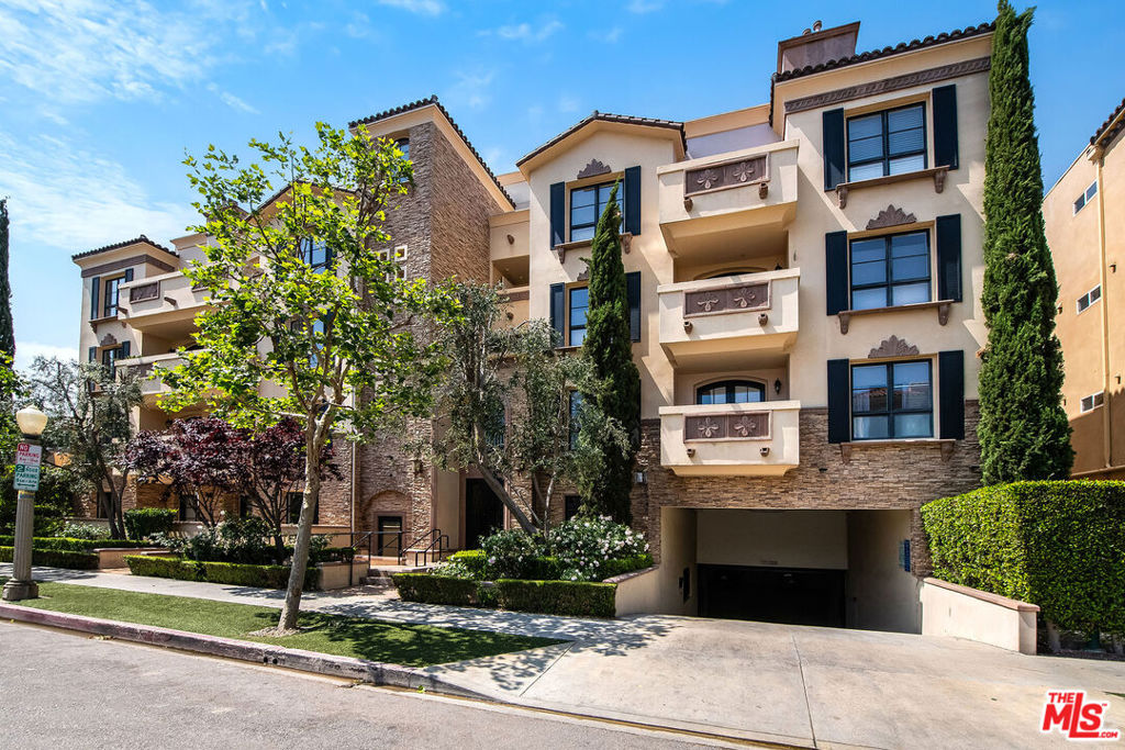 Luxurious Penthouse Living in the Heart of Studio City. Welcome to 12026 Hoffman St, Unit 404 an exceptional penthouse condo that redefines upscale urban living. Perfectly situated in the vibrant heart of Studio City, this rare top-floor residence offers an unparalleled lifestyle just steps from the iconic CBS Radford Studios, the beloved Studio City Farmers Market, and the ever-convenient Trader Joe's. Spanning 1,552 square feet of thoughtfully designed living space, this three-bedroom, three-bathroom home exudes elegance and sophistication at every turn. Upon entry, you'll be immediately captivated by soaring ceilings, rich hardwood floors, and an abundance of natural light illuminating every luxurious detail. The remodeled chef's kitchen is a culinary dream, featuring premium stainless steel appliances, sleek quartz countertops, custom cabinetry, and ample prep space perfect for both everyday living and entertaining on a grand scale. The main living and dining room area, complete with cozy fireplace, seamlessly flow onto a private deck with views of the hills, ideal for morning coffee or sunset gatherings. Each bedroom offers generous space and privacy, with the primary suite boasting a spa-inspired en-suite bathroom, walk in closet, and it's own entrance to the back patio offering a peaceful retreat from the energy of the city. Additional features include ample storage throughout, serene fountain courtyard, secure gated parking, all within a beautifully maintained building that reflects true pride of ownership. Experience the pinnacle of Studio City living in this luxurious penthouse condo where comfort, style, and location converge in perfect harmony. Offered exclusively for the discerning buyer.