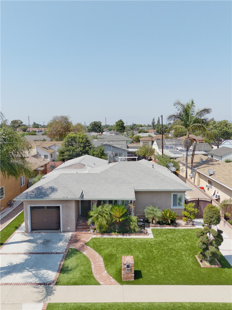 Welcome to this home offering comfort, versatility, and modern touches throughout. Featuring two en-suite bedrooms, this layout is ideal for multi-generational living, guests, or added privacy. Enjoy an abundance of natural light, ample closet space, and low-maintenance artificial grass in both the front and back yards. The spacious back patio is perfect for entertaining, while the front patio offers additional space to relax. Centrally located near major freeways, shopping, schools, and dining—this home combines convenience with lifestyle. A must-see gem in Norwalk!