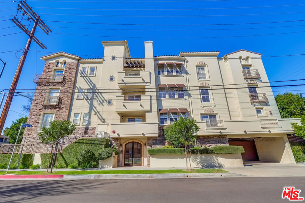 Welcome home to a beautiful 2-bedroom, 2-bathroom residence in prime Studio City, CA 91604-soley owned by an award-winning filmmaker. This immaculate, single-level condo, spanning across 1200 sq feet, is perched on the second floor of a secure and meticulously maintained 14-unit Mediterranean-style building with elevator. From the moment you enter, you'll be captivated by the light-filled living room featuring south-facing views of the iconic Hollywood Hills and a cozy fireplace, perfect for entertaining or unwinding. An exquisitely remodeled galley kitchen flows into the adjoining dining and living areas, creating a seamless space for gatherings or quiet meals. Step out onto your private balcony to enjoy the California sunshine, fresh air and hilltop vistas, or head up to the residents-only rooftop terrace for more breathtaking views of the sunrise, sunset, and panoramic hills. Retreat to the spacious master suite, also with stunning views of the hills, complete with an expansive walk-in closet and a luxurious ensuite bath featuring dual sinks, soaking tub, and a separate shower. The stylishly appointed hallway bathroom is available to the second bedroom & for guests. This condo's prime location can't be beat. Enjoy the tree-lined family and dog-friendly neighborhood, 2 blocks to trendy shops, restaurants and cafes on Ventura Boulevard and fresh produce at the Studio City Farmer's Market. Take advantage of nearby Studio City Library, Trader Joe's, Whole Foods, Erewhon, Corepower Yoga, Pilates, Equinox, Shops at Sportsman's Lodge, Tujunga Village, Riverwalk, hiking trails of Fryman Canyon and a short drive to The Hollywood Bowl, Dolby Theater, Warner Brothers, Universal, Disney, Sunset Plaza, Mulholland and Rodeo Drive. Perks include a brand-new HVAC system, top-of-the-line appliances, recessed lighting, pull-out kitchen and bathroom cabinets, recently waterproofed roof on the building, two EV-ready tandem parking spaces, with guest parking and a bike rack, inside the highly regarded Carpenter School District, with the added peace-of-mind of a security system, sprinklers, earthquake and fire coverage under the HOA's master insurance policy. With its unbeatable location, impeccable condition, and array of top-of-the-line amenities, all within a safe and secure building, 4202 Whitsett Ave, Residence 205, is your ticket to the absolute best of Studio City living. Don't miss out, schedule your viewing today and make this residence your new home sweet home!