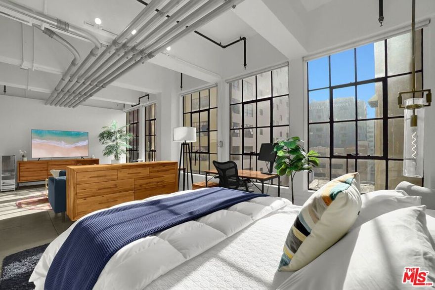 Wake up to the golden glow of the city as sunlight floods your modern loft, framing views of downtown Los Angeles that never get old. This 7th-floor home captures everything that makes city life magnetic. Light, energy, and effortless style. Your mornings start with coffee and skyline views; your evenings end with the city lights reflecting through tall windows as you unwind above it all. Thanks to the Mello-Roos Act, property taxes stay refreshingly low, letting you enjoy more of what matters. Dinners at nearby restaurants, strolls through the Fashion District, and weekend discoveries in the heart of the city. This is downtown living designed for those who crave sunlight, simplicity, and soul. Welcome home to #707, where the city becomes your everyday view.