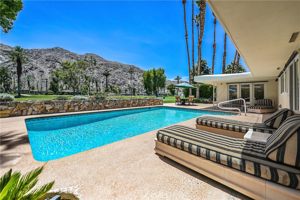 Prestigious Guard Gated within Indian Wells Country Club. Mid-Century Home with MILLION $ VIEW! FULLY FURNISHED AND EQUIPPED. This highly sought-after SOUTH FACING home with a pool is directly on the 8th fairway with breathtaking unobstructed views of the Indian Wells golf course and Santa Rosa Mountains. The large private primary suite is separated from the rest of the bedrooms and has a private patio. Featuring 2 king-sized beds, 3 queen-sized beds, plus a sofa pull-out double bed and will accommodate up to 12 people. Extra deep 2 car garage and curved driveway with off-street parking for 6 additional cars. Spacious open floor plan features 4 bedrooms and 3 baths (or 3 bedrooms + attached Casita). Each bedroom has its own flat-screen TV. The gourmet kitchen has granite countertops, all stainless steel appliances, a 5 burner gas cooktop, and a spacious nook. The large open great room features a dining room area, gas stone fireplace with a raised hearth, a large flat-screen TV, and a huge sectional for comfortable seating. *SEE VIDEO*
AVAILABILITY: Now through November 30, 2025. HOME IS LEASED: December 1st 2025 through April 30th 2026. May 1st-September 30th for $6,500/mo. October: $6,900/mo., November: $7,500/mo. Rented by season. **RENTS ARE BASED ON 30 DAYS MINIMUM** See the floor plan in the last photo and a video “360” icon. Shorter terms are available.