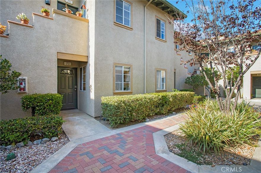 Charming single-level residence located in the scenic of Tijeras Creek Villas. A picturesque courtyard leads you to an inviting and upgraded open and light filled floor plan. The spacious living room features a stacked stone two-sided fireplace with gas logs and a French door that opens to a private, covered patio. The cheerful kitchen includes windows on two walls overlooking the private courtyard. The kitchen has been updated with white cabinetry, granite countertops, recessed lighting stainless appliances that include 5 burner gas range, microwave, dishwasher and refrigerator. The primary bedroom opens through tall sliding doors to the peaceful patio and also includes a mirrored closet with an organizer system. The remodeled bathroom features a white shaker style vanity, framed mirror, brushed fixtures and lighting plus additional cabinetry with glass doors providing additional storage. This home also offers a full-size front-loading washer and dryer (included), a hall closet, and additional storage spaces off the patio. You'll also appreciate the oversized one-car garage for even more storage with new roll up garage door, opener and walking access door. Community amenities include two pools (one with Tijeras Creek Golf Course views), a spa, sauna, and fitness center, along with full access to SAMLARC amenities such as pools, sports courts, parks, and the popular Lago Santa Margarita Beach Club with private events. Tucked in a private setting surrounded by views of trees and mountain views. with maintained landscaping and cul-de-sac location ensures a tranquil living experience. This home offers both comfort and convenience—just a short walk to the award-winning Arroyo Vista K-8 school in CA's safest city.