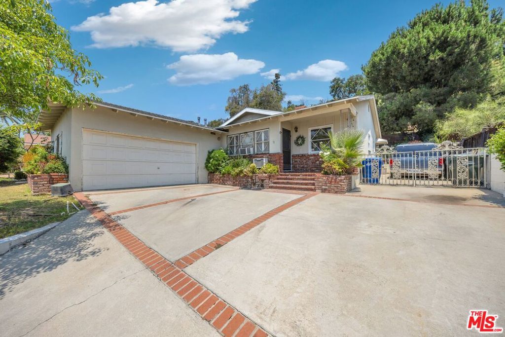 PRIME NORTH MONROVIA LOCATION! . Great traditional home that offers a modern lifestyle. Property consists of a spacious living room with gas fireplace and built-in shelving, dining area, kitchen with tile countertop & backsplash and plenty of cabinets for storage and a door that leads to the backyard. All of three bedrooms are spacious. Two of the bedrooms have walk-in closets and the third bedroom is currently being used as family room with a french door that opens to the backyard. This bedroom is adjacent to a bathroom with shower that also opens to the kitchen. Spacious second bathroom features a separate tub and shower with double vanity and linen closet. Warmth and natural light abound throughout the house. Enjoy gatherings in the backyard surrounded with lush planting and mature trees. There's an open patio above where you can relax under the tree and enjoy the view and sights and sounds of nature. Roof is only 2 years old. Must See!