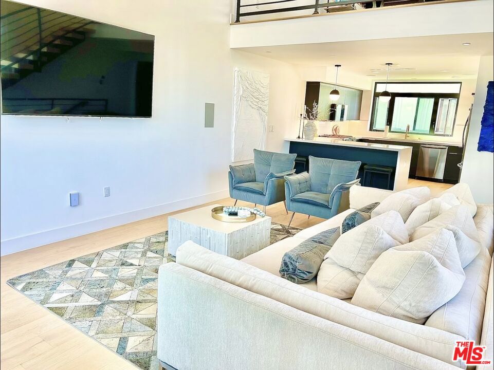 Move in Ready . well taking care of modern Home with roof top, play room area and entertainment delight .North of Hollywood ,corner lot unit .The main living room is located in the second floor features a breath taking open space with high ceilings, fire place perfect to ad your custom furniture with the open space to the kitchen with all stainless steel appliances with a waterfall island quartz counter tops with a breakfast bar must see to appreciate , lots of upgrades on this unit .call me for a private view.