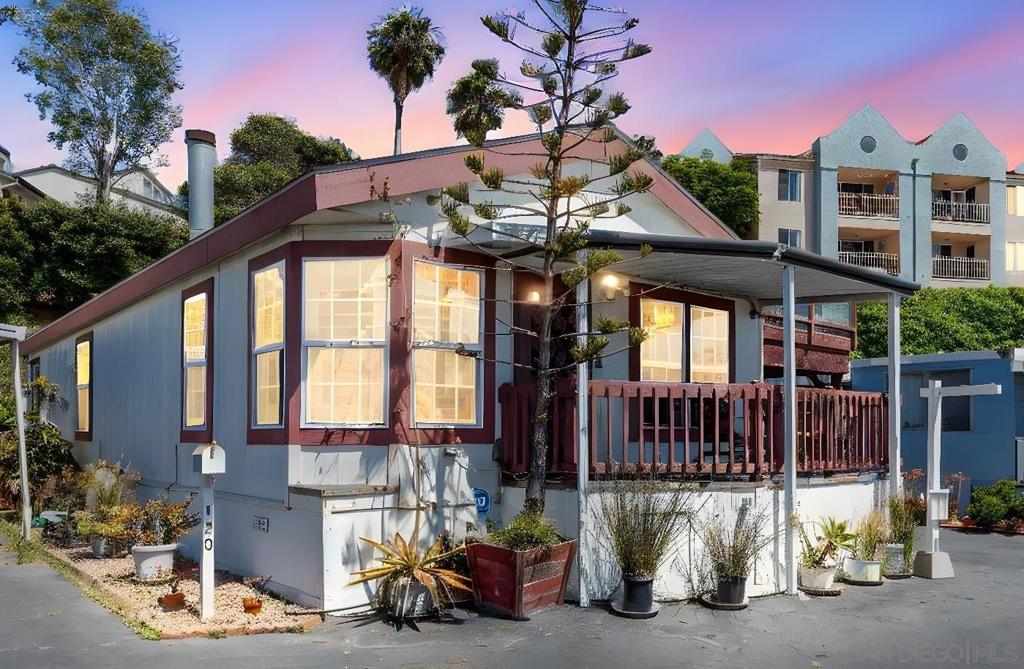 Enjoy ocean breezes and coastal views from your private rooftop patio in this beautifully maintained 2-bed, 2-bath home in the 55+ La Salina Mobile Village. The light-filled interior features natural wood flooring, a spacious living area, and a well-appointed kitchen with plenty of storage. The primary suite includes a private bath, and there’s also an indoor laundry room and newer combo heating and A/C unit. Rare chance to live near the beach with stunning rooftop sunsets! Stone showers in both baths. Step outside to your private ROOFTOP deck and enjoy stunning ocean views—perfect for relaxing or entertaining. The home also includes a covered porch and private outdoor space. La Salina is a welcoming senior park just blocks from the beach, offering amenities such as a clubhouse, pool, and community events. With convenient access to shopping, dining, and public transportation, this home offers the perfect blend of comfort, community, and coastal living.