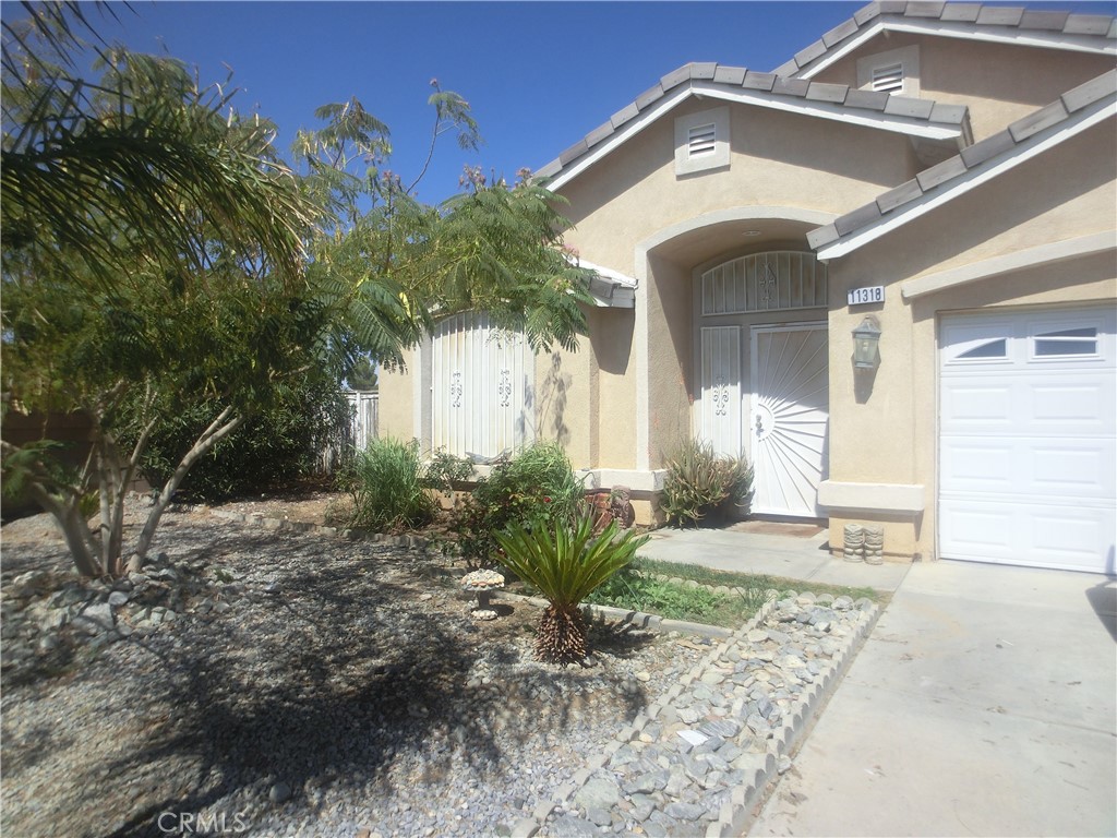Great starter home with 1815 sqft of comfortable living space. Step inside an open floor plan with tile through out. The kitchen and family room area are connected with a nice open space and a fireplace. The kitchen has a pantry and new cabinets. The house features 4 bedrooms and 2.5 baths. The master bedroom has wood vinyl flooring.