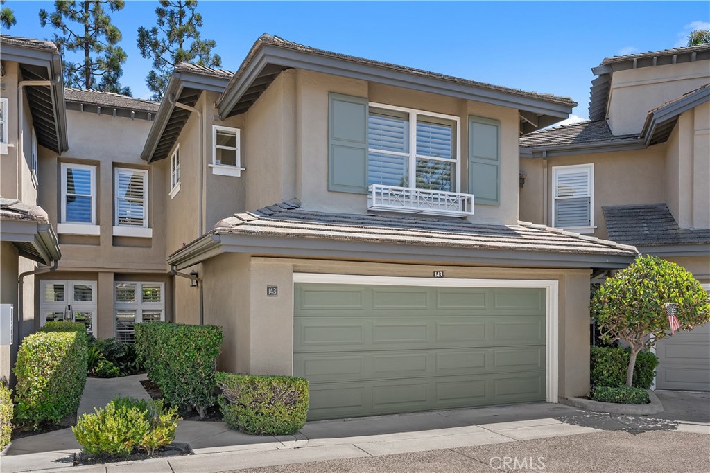 This two-bedroom, two-and-a-half-bathroom townhome located in the gated community of Cameray Pointe in Bear Brand Ranch boasts light-filled interiors with high ceilings, creating an airy and open feel throughout. As you enter the home you are welcomed with soaring ceilings and high windows introducing ample natural light while preserving privacy and maximizing usable wall space. The living area features built-in shelving, a cozy fireplace and French door leading to the back. Stepping outside, the large enclosed patio offers additional living space, perfect for outdoor relaxation or entertaining. The engineered wood flooring lend a contemporary aesthetic, complemented by new paint throughout. The kitchen features marble countertops, breakfast nook and pantry plus a large window overlooking the lovely hardscaped patio with custom pavers and a gate access to the community. The primary bedroom suite includes an en-suite bathroom and a spacious walk-in closet, as well as a cozy fireplace, providing a private retreat. The second bedroom also features an en-suite bathroom, ensuring privacy and convenience. Centrally located between bedrooms you will find an upstairs full-size laundry closet for added convenience. Cameray Pointe townhomes have access to the community's amenities, including a pool and spa, offering a refreshing respite on warm days. The gated community and private setting provide a serene and secure living environment. All of this and located within walking distance to Ocean Ranch Shopping center with fine and casual dining, a gym, Trader Joe's, Cinépolis and much more!