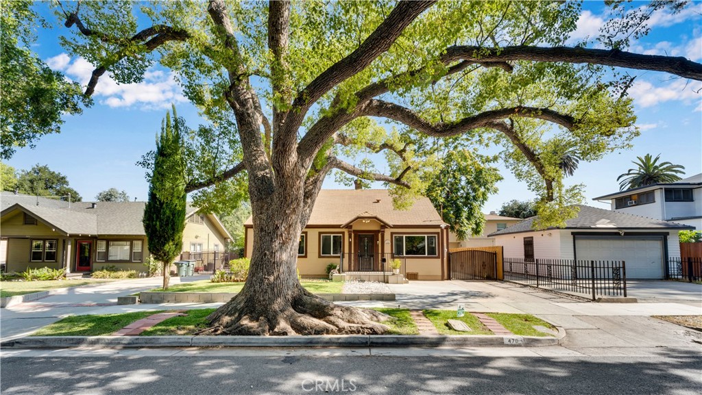 Charming 1922 bungalow that beautifully blends original character with thoughtful upgrades. Enter through a spacious front porch into inviting living room featuring tile flooring, crown molding, a fireplace and abundant natural light. Updated kitchen and windows overlooking the backyard patio. This home offers 3 bedrooms and 1 bath however title has it as 2 bedroom and 1 bathroom. A gated driveway leads to one-car garage and private grassy yard- perfect for relaxing and entertaining. The garage has been turned into a bedroom with 2 generous closets and a bathroom. Electrical panel has been updated 5 years ago with underground wiring. The loft has been converted into a bedroom and bathroom with private entrance. A basement for added storage.