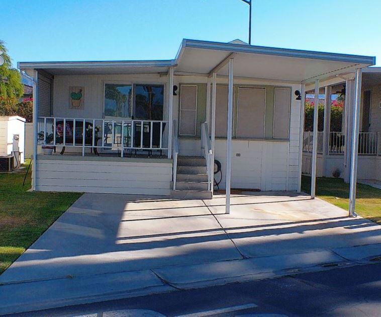 Turnkey, Park Model/RV home in a 55+ RV Resort Community, Rancho Casa Blanca, where you own the land & is perfect for your winter hideaway. Rancho Casa Blanca (RCB) features a beautifully landscaped 80-acre property w/801 individually Park Model homes/or RV sites. Two large clubhouses that function as social hubs & 4 satellite buildings with laundry facilities, mail boxes, heated pools & spas. Add in a well-manicured 18-hole par 3 golf course w/expansive views of the mountains, a 9-hole putting course, 2 practice chipping/putting greens, 6 heated pools/spa, 2 tennis courts, 8 pickle ball courts, shuffleboard courts, horseshoe pitch & a fitness center. This home is one that you will want to spend a month or a whole winter season. The home has Roll Down Shutters for privacy, tiled deck with beautiful views of the west mountains, storage shed and an Upgraded Tile Shower/Faucets and a sitting area in Shower. Mirrored Closet Doors in Bedroom. Don't miss this one. It will Sell Fast!