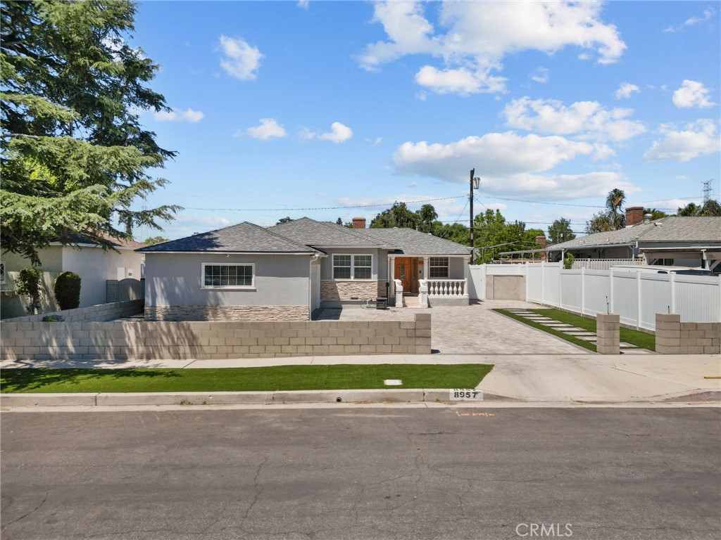 Welcome to this beautifully updated 3-bed, 1-bath home, offering a blend of meticulous modern convenience and timeless charm. The living area features vaulted, exposed wood beam ceilings, creating a warm, inviting space with abundant natural light from the numerous windows and skylights. The rich wood floors add a touch of elegance, making this home ideal for both relaxing and entertaining.
The kitchen is a chef’s dream, equipped with granite countertops, ample cabinetry, and newer stainless steel appliances, including a gas range, microwave, and dishwasher. The seamless connection to the dining area makes hosting gatherings a breeze.
The primary bedroom offers a tranquil retreat with ample natural light, while the additional bedrooms provide flexible space for loved ones or guests. An additional room overlooking the back patio is ideal for a home office. The shared bath is tastefully updated with a modern double-sink vanity, walk-in shower, and designer fixtures.
Step outside to your private, low-maintenance backyard, featuring an expansive paved patio area perfect for outdoor dining, barbecues, or relaxing in the sun. The attached garage includes convenient storage and laundry facilities, and the spacious driveway offers plenty of parking.
Additional features include central HVAC for year-round comfort, dual-pane windows for energy efficiency, solar panels to help lower utility costs, and a prime location with easy access to nearby parks, the University of Northridge, Northridge Mall, shopping, dining, and major freeways for quick commutes throughout the Greater Los Angeles area