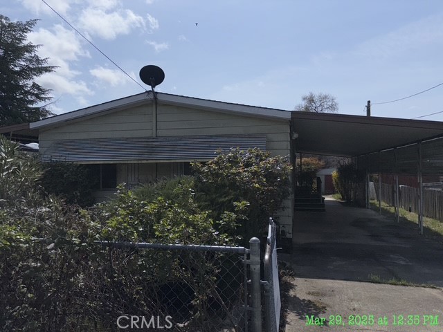 Mountain views from this 2 bedroom, 2 bath, plus dining room home. Fenced lot, carport, and shed. Patio area.