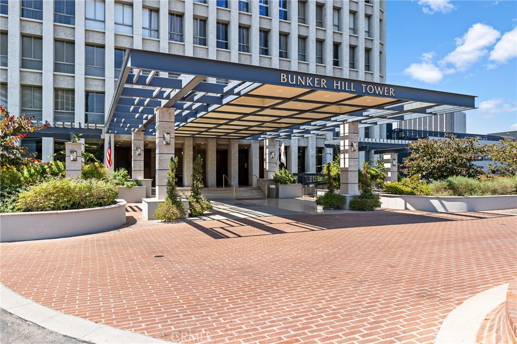 Spectacular city lights and sunset views from the 22nd floor complement this spacious open concept residence at prestigious Bunker Hill Tower. Its contemporary interior design is highlighted by floor to ceiling glass walls, raised ceiling w/ finished beams, wavy textured wall panel and LED track lighting throughout. The open bedroom features incredible views down Grand Ave. An updated bath features a glass walk-in shower, floating vanity w/ mirror and white lacquer linen cabinet. The stunning kitchen is outfitted with stainless steel appliances, double door refrigerator, gas stove top w/ custom backsplash and vent hood. This unit also includes 1 assigned and guest parking space, 24hr attended front desk and more. HOA dues includes all utilities: water, trash, gas, electricity, internet and basic cable. Bunker Hill Tower is an exclusive residential community offering unparalleled amenities like swimmer's pool, tennis and pickleball courts, fitness centers and private event space! Call this incredible space home!
