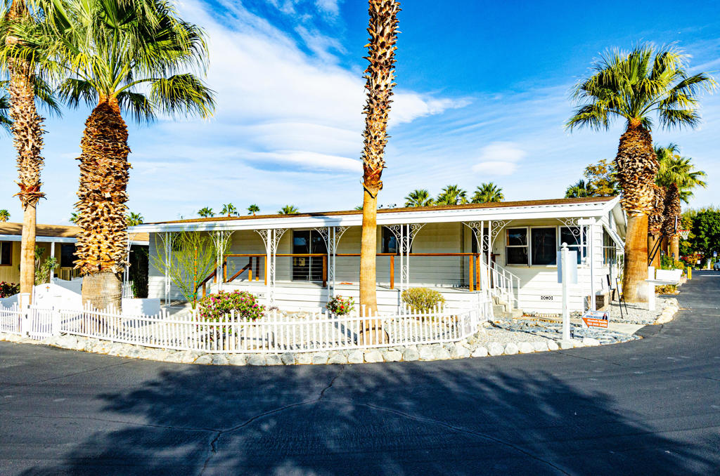 In the Desert Palm Community, a bigger unit with a garage and an additional extra-large lot with a water fountain. A spacious 2 bedroom and 2 baths with enough space to make a third bedroom. The Master bedroom has an on-suite bath. The home has new flooring, new inside and outside paint and new outside patio. Community amenities include a new covered playground, new pool and BBQ area, happy people live here!