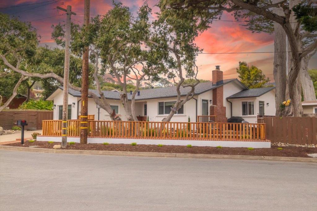Step into coastal bliss with this beautifully remodeled gem nestled in one of Pacific Grove's most desirable neighborhoods. Every inch of this turn-key treasure has been thoughtfully upgraded, including roof, gutters, electrical, and plumbing, to a refined stucco exterior, dual pane windows, fireplace insert with remote, and gleaming refinished wood floors. The designer kitchen and spa-inspired baths offer modern comforts wrapped in timeless style. Outside, the freshly landscaped front yard and new fencing add curb appeal and privacy, setting the scene for relaxing mornings or sunset gatherings, including a Peek-a Boo view of the bay! Perched on a generous 6,400 sq ft lot, the property invites endless outdoor possibilities. Just a short stroll to Downtown Pacific Grove and the iconic Lovers Point, it's perfectly placed to enjoy everything this charming seaside town has to offer. Located in the highly-rated Pacific Grove School District, this home is ideal for families or anyone seeking a blend of elegance and ease. Whether you're settling in or seeking a getaway, this home is ready to welcome you with nothing left to do but enjoy.