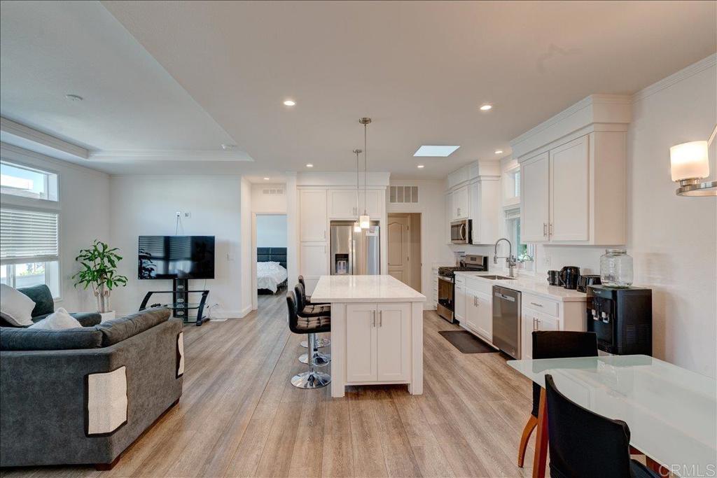 Why compromise when you can have it all? Enjoy modern comfort, peace of mind, extra space, and a prime location, ALL for a fraction of the coastal price. Built in 2024, this stunning open-concept home shines with bright natural light, beautiful laminate flooring, and a fully equipped kitchen featuring stainless steel appliances and a spacious island perfect for meal prep, casual dining, or entertaining. With 4 bedrooms, it’s ideal for families, remote workers, or anyone needing that extra room for a home office, gym, or guests. Plus, a separate laundry area keeps your home organized and clutter-free. Located in a welcoming ALL-AGES family park with low space rent of just $500/month, enjoy fantastic amenities like 2 swimming pools, 2 clubhouses, 2 car wash stations, and a playground. Just 10 minutes or less to the beach, Goat Hill Park golf course, Ocean’s Eleven Casino, Legoland, restaurants, grocery stores, breweries, gyms, public transit, postal services, shopping malls including Carlsbad premium outlet mall, Major Car Dealerships & More. Don’t miss your chance, schedule your tour today!