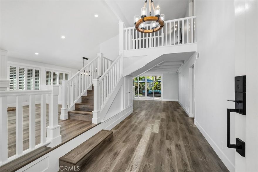Welcome to your dream coastal home in San Juan Capistrano! Step into this expansive, light-filled and beautifully maintained two-story residence nestled just moments from the heart of historic downtown San Juan Capistrano. Ideally located near the vibrant River Street Marketplace, local schools, the brand-new San Juan Capistrano Skatepark and just minutes from Doheny Beach and the revitalized Dana Point Harbor, this home offers the perfect blend of convenience, charm and coastal living. Boasting 5 bedrooms, 3.5 bathrooms and a versatile upstairs loft, this generous 2,516 sq ft floor plan provides ample room to live, work, relax and entertain. The main level features a welcoming formal living room with a cozy fireplace that flows effortlessly into a generous dining space and a chef’s kitchen equipped with stainless steel GE Profile appliances, abundant cabinetry and ample counter space for culinary creativity. Just off the kitchen, a comfortable casual living room opens via sliding glass doors to a large, low-maintenance backyard oasis great for outdoor dining, entertaining or soaking up the sun. Enjoy the included patio furniture, a vast space for RV parking and a fenced-in garden area ready for planting your favorite herbs or vegetables. Tucked away on the main floor, the private primary suite offers a peaceful retreat complete with its own access to the back yard, a spacious en-suite bathroom and a walk-in closet. There's also a powder room for guests and direct access to the two-car garage which makes daily routines a breeze. The garage is thoughtfully equipped with a washer, dryer, second refrigerator and a flex workshop/storage room ideal for hobbies or organization. Upstairs, the loft presents a perfect space for a home office, media lounge or wellness area. Four additional bedrooms, each featuring sliding barn-style closet doors, share two full bathrooms and the front-facing upstairs bedroom includes a sliding glass door that leads to a wide balcony with city views. Just a few blocks away, you'll find access to the San Juan Creek Trail, a scenic pedestrian and bike friendly path that connects you directly to downtown San Juan Capistrano in one direction and to Doheny State Beach and Dana Point Harbor in the other. With beaches, dining, shopping, schools, trails and freeway access all within reach, this move-in-ready home is a rare opportunity to enjoy the very best of Southern California coastal living.