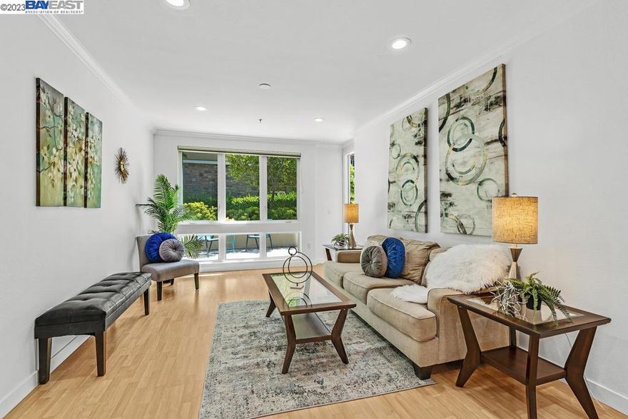 Welcome to this one-of-a-kind single-level condo located in the tranquil Elan community. Situated in a quiet interior garden setting, this condo offers a unique and peaceful living environment. With its open floor plan and abundance of natural light, this home provides a bright and airy atmosphere throughout. Spanning 1234 sq. ft., this condo is located on the second floor and boasts floor-to-ceiling windows in every room, allowing natural light to flood in. The living room and master bedroom offer French door access to the balcony, providing a perfect spot to relax and enjoy the outdoors. As you step inside, you'll notice the engineered hardwood floors that flow seamlessly from the entryway to the kitchen, dining room, and living room. The bathrooms feature elegant tile flooring. The interior has been freshly painted, and recessed ceilings add a touch of sophistication to the space. The kitchen is adorned with natural-colored cabinets, granite countertops, and stainless steel appliances, creating a modern and stylish cooking area. Adjacent to the kitchen is a designated laundry room with built-in cabinets, providing convenience and ample storage. The location of this condo is ideal for city commuters, with convenient walkability to the BART station.