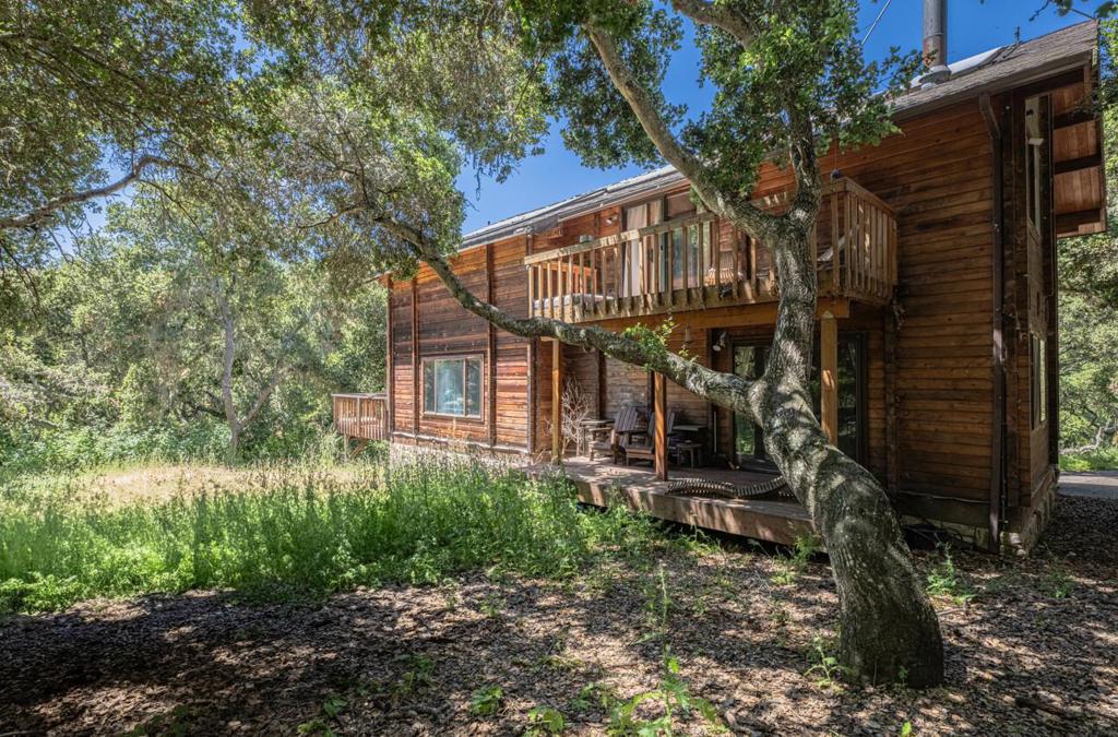 Peaceful Carmel Valley Hideaway with Guest House, Bonus Studio & Breathtaking Views on 2.9 Acres! Nestled in the serene Hidden Hills of Carmel Valley, this enchanting 2.9-acre property offers a rare blend of privacy, versatility, and panoramic views. The 1,800 sq.ft. main residence welcomes you with cathedral ceilings, which allow abundant natural light, an inviting fireplace, updated flooring, and a thoughtfully designed kitchen with generous counter space.Two spacious bedrooms, two full bathrooms, and a dedicated laundry area. Just steps away, a secluded 650 sq.ft. the guest house provides two bedrooms, one bath, and sweeping valley vistas for extended family, visiting friends, or rental opportunities. A charming barn-style detached garage includes a versatile loft bonus room, offering endless possibilities: art studio, home office, or an additional guest retreat. The grounds are dotted with mature landscaping and open spaces ready for your vision. Build a pool, start a garden, or create a small horse setup. Located in the coveted Washington Union School District, it is just minutes from Carmel Valley Village,Carmel-by-the-Sea, and all the beauty of the Monterey Peninsula.
