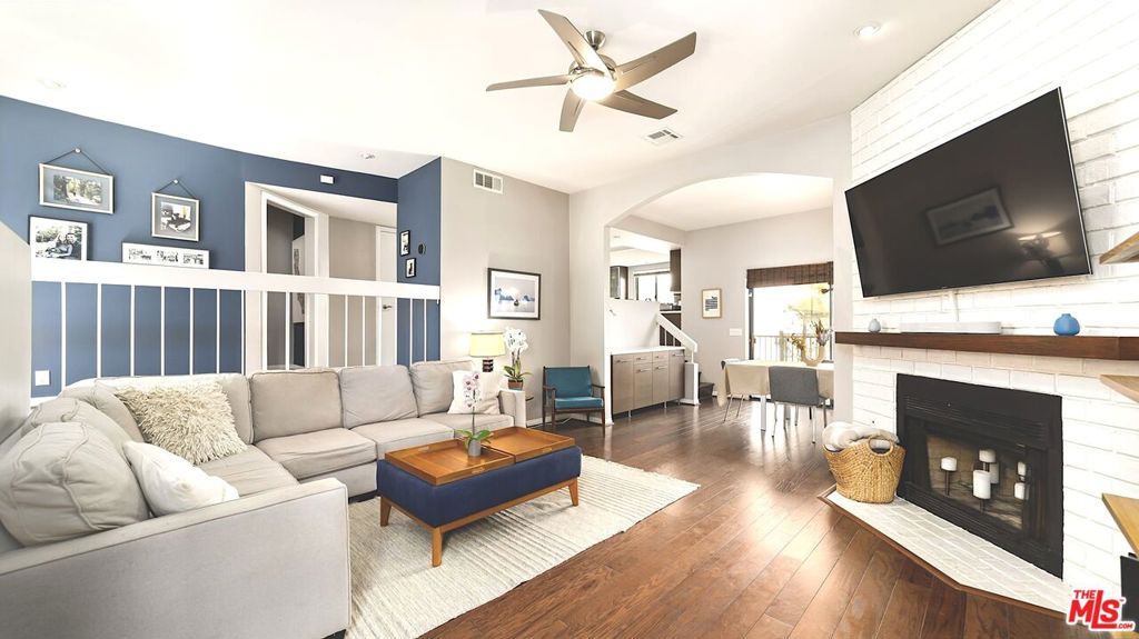 Truly a rare find in a great location! This stunning spacious home is located in the heart of Culver City, surrounded by cafe's, parks, and shopping. A special front unit townhouse with vaulted ceilings, loads of natural light, and tree top views from the upper level. Enter into an open floor plan that flows from a spacious living room, to the dining room with built-in serving station, and out to a hedged balcony perfect for weekend BBQ's. Designer updates in every space define this special offering and make it an entertainer's dream. The elegant, elevated kitchen features updates throughout including new stainless steel sink with instant hot water spigot. A chic powder room and dedicated laundry closet round out the main floor. Upstairs are two generously large bedrooms, each with walk-in closets. The primary suite has new hardwood flooring, sound-proof windows, and a gorgeous en-suite bathroom. The second large bedroom includes remote control shades, sizable closet with built-in shelving, plus its own private balcony. An additional, well updated bathroom with a porcelain tub is a perfect retreat at the end of the day. With so much space, this floor plan can become a comfortable three bedroom! Downstairs is a large two-car garage plus a storage room with shelves and room for skis, bikes, and more. Additional upgrades include new HVAC, new microwave, Smart Lock at entry, and overhead storage shelf in garage. HOA recently invested in updating outdoor balconies. This townhome offers all the amenities for modern living and is located in one of the best locations. Just moments away from Downtown Culver City, the Baldwin Hills Scenic Overlook, The Culver Steps, Ballona Creek Bike Path, Silicon Beach, and loads of dining and entertaining options. Located in the highly rated Culver City Public School District. Low HOA fees include EQ Insurance.