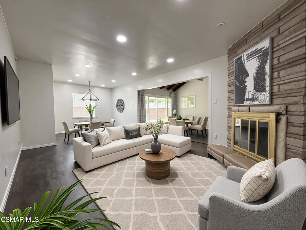 Step into this beautifully remodeled single-story home featuring 3 spacious bedrooms and versatile living spaces designed for today's lifestyle. Two large flex areas provide endless possibilities--whether you're envisioning a family room, entertainment lounge, den, or even a potential 4th bedroom. The dining area flows seamlessly from the kitchen into the living spaces, making everyday living and entertaining a breeze. The kitchen boasts granite counters, bright natural light, and brand-new appliances, while new laminate flooring throughout contrasts elegantly against crisp white walls and baseboards. One bedroom offers a convenient en-suite layout with dual entrances--ideal for a home office or guest retreat. Down the hall, you'll find another guest bedroom and the primary suite, each with ample closet space, complete with double-shelf organizers for maximum storage. A dedicated laundry room is thoughtfully positioned just off the kitchen and garage, complete with a new stacked washer/dryer unit. Outdoors, the property truly shines. The backyard is a massive, private retreat perfect for entertaining, kids at play, or simply relaxing under the California sun. Freshly installed artificial turf in both front and back yards ensures year-round beauty with minimal maintenance. On the side, a wide, secured area with new vinyl fencing and gates offers incredible flexibility for boat or RV parking, extra storage, or a hobby space. The sprawling front yard, oversized lawn, and expansive driveway provide even more functionality and curb appeal. Inside and out, this home is move-in ready and filled with thoughtful updates. A must-see opportunity you won't want to miss!