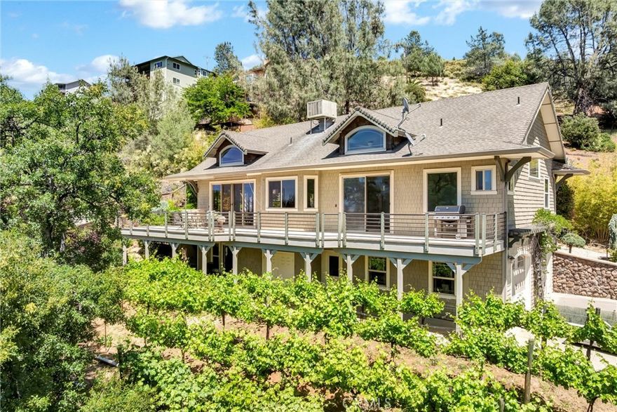 Experience Lakeside Luxury with Breathtaking Views! Step into the serenity and elegance of this expansive residence in the desirable Kelseyville area, boasting sweeping vistas of Clear Lake and majestic Mt. Konocti. This home is thoughtfully designed to accommodate various living arrangements, making it perfect for a range of lifestyles. The upper level showcases a sunlit and airy floor plan, featuring a cozy living space with a charming fireplace, a formal dining area, and a well-appointed kitchen that is ideal for both daily living and entertaining. Two spacious bedrooms, including a master suite with access to a sizable deck, a walk-in closet, and a luxurious ensuite bathroom with a walk-in shower and a separate soaking tub, complete the upper level. The lower level, with its own private entrance, offers a third bedroom, a home theater, and a wet bar, presenting an excellent opportunity for a guest suite, an artistic retreat, or a recreational haven. Outside, the property is a haven of tranquility, boasting a serene koi pond with a cascading waterfall, flourishing grapevines, and multiple relaxation areas. The expansive driveway and additional parking spaces provide ample room for vehicles, watercraft, or outdoor gear. Just a short distance from a public boat launch and marina, this home offers easy access to a plethora of water activities, including boating, kayaking, and fishing on Clear Lake. Nestled at the foothills of Mt. Konocti and surrounded by vineyards, local markets, and dining establishments, this residence strikes a perfect balance between natural splendor and community conveniences.