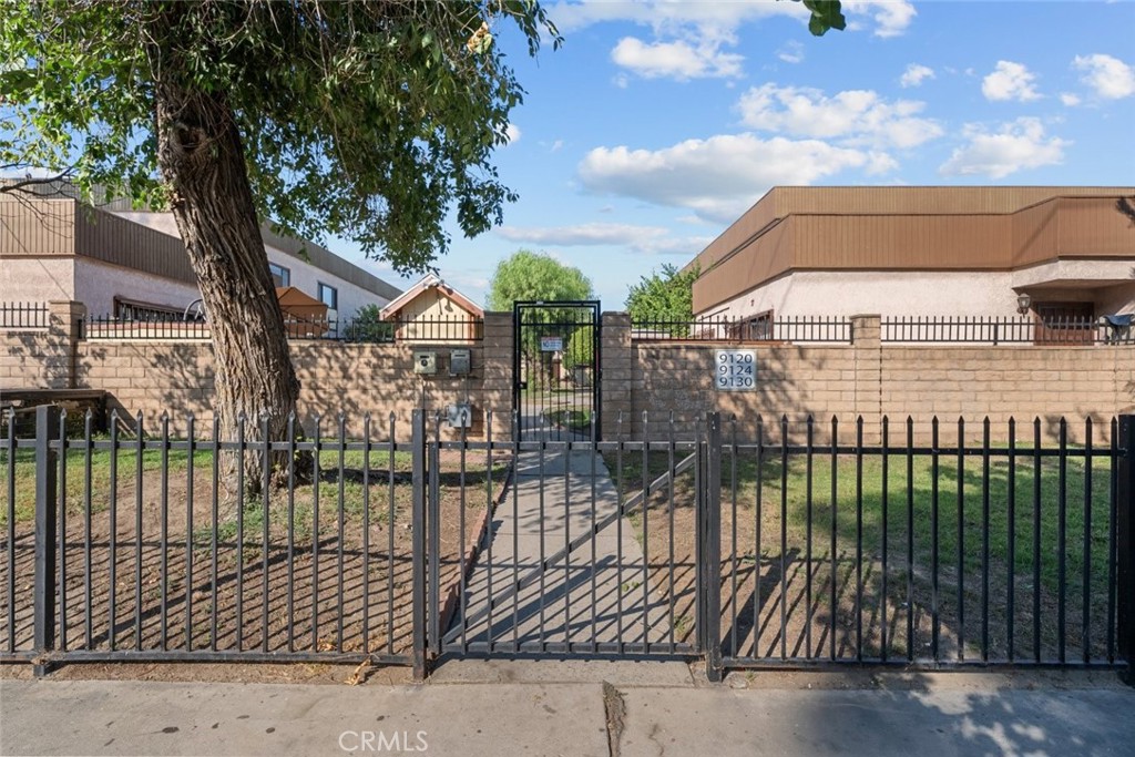 Welcome to 9120 Telfair Avenue #14, a spacious 3-bedroom, 2.5-bath townhouse offering 1,502 sq ft of comfortable living in the heart of Sun Valley. This well-maintained home features a bright and inviting living area with durable laminate flooring and direct access to a private, enclosed patio - perfect for relaxing or entertaining. The large kitchen is equipped with granite countertops, tile flooring, and ample cabinet space, making it ideal for both everyday meals and special gatherings. Convenient in-unit laundry is located on the main level for ease and efficiency. Upstairs, you'll find generously sized bedrooms, including a primary suite, and plenty of storage. The property also includes two detached carport spaces for added convenience. Situated close to schools, shopping, dining, and major freeways, this home blends comfort, practicality, and a great location.