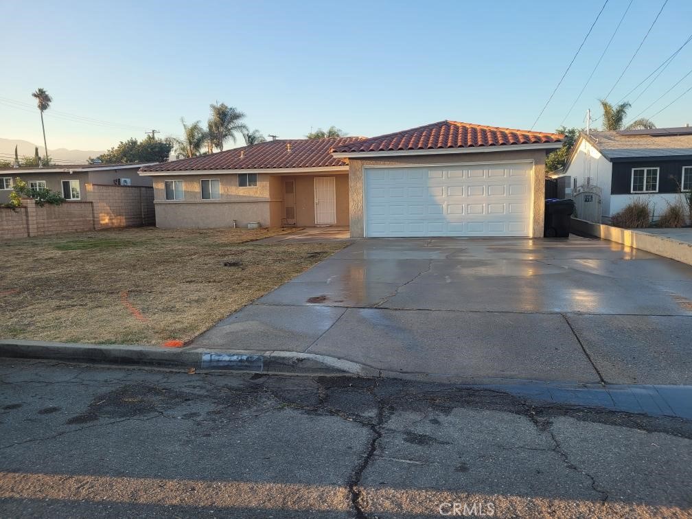 Charming 3-Bedroom Home for Rent in Fontana! This well-maintained single-story home offers 3 spacious bedrooms, 1 full bathroom, and a comfortable layout that’s perfect for families or anyone looking for a peaceful place to call home. Located in a quiet residential neighborhood, the home features approximately 1,005 square feet of living space and sits on a generous lot with a large backyard—ideal for entertaining, relaxing, or letting pets roam freely. Inside, you’ll find tile flooring throughout, a bright living area with updated windows, and central air and heat to keep you comfortable all year long. The formal dining area is perfect for family dinners or hosting guests. The kitchen offers ample storage, and there are washer and dryer hookups for added convenience. The home also includes a 2-car garage and additional driveway parking. The backyard provides a great outdoor space with plenty of room for gardening, gatherings, or play. This property is located just minutes away from schools, parks, shopping centers, and freeway access. Tamarind Park and local schools are within walking distance, making this a great spot for families. This lovely home is move-in ready and available now. Don’t miss your chance to live in a desirable Fontana neighborhood—contact us today to schedule a private showing!