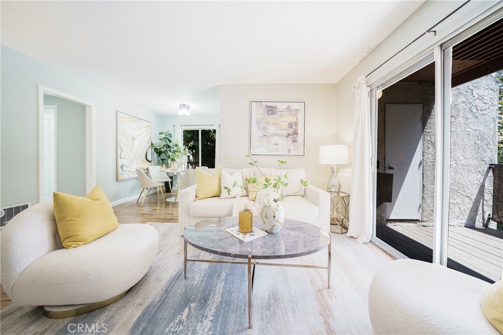 This wonderfully upgraded, move-in ready La Habra condominium is located in the gated community "Fashion Heights." This beautiful upper end unit offers extra privacy and a relaxing pool view. Featuring 2 bedrooms and 2 bathrooms, it provides a peaceful retreat within a quiet complex. The slate tile entryway leads into a cozy living room with a built-in gas fireplace, while the patio is perfect for BBQs and extra storage. The spacious master bedroom includes generous closet space and a private bathroom. Recent upgrades include new appliances: wall-unit AC, stove oven, refrigerator, and dishwasher. The HOA covers the roof, water heater, common area maintenance, gas, trash, water, termite treatment, pool, gated access, laundry facilities, and garage. Conveniently located within walking distance of major shopping centers, restaurants, grocery stores, Walmart, Lowe’s, Sam’s Club, LA Fitness, a movie theater, and more. The home also comes with a 2 car detached garage.