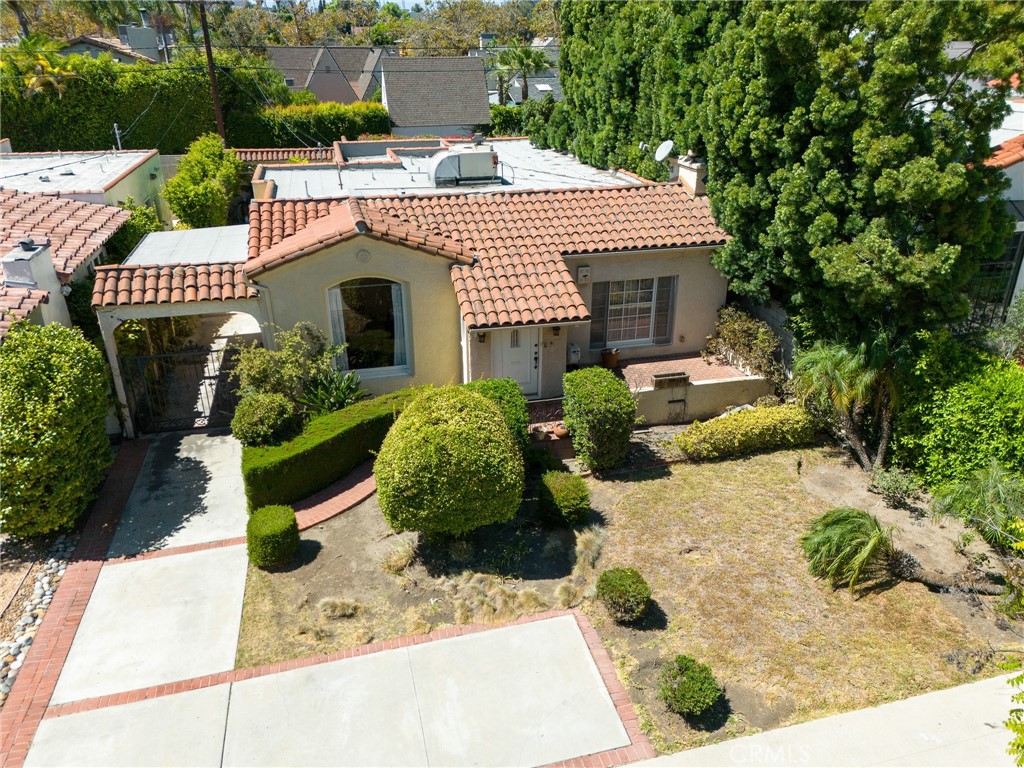 This enchanting Spanish-style home, built in 1929, offers a distinctive opportunity to reside in a coveted Beverly Hills neighborhood near Wilshire and Robertson. The 3 bed, 2 bath, and approximately 1,750sft interior will surprise and delight you with its authentic Art Deco styling and period details. The living room features a fireplace which is highlighted by the room’s large windows, allowing for ample natural light. The kitchen has abundant cabinetry and connects to both a breakfast nook and formal dining room, perfect for entertaining. The bedrooms are well appointed and complemented by sizeable bathrooms. Outside, a spacious outdoor living area with large deck provides the perfect setting for al fresco dining, entertaining, or lounging. The property can be rented furnished.