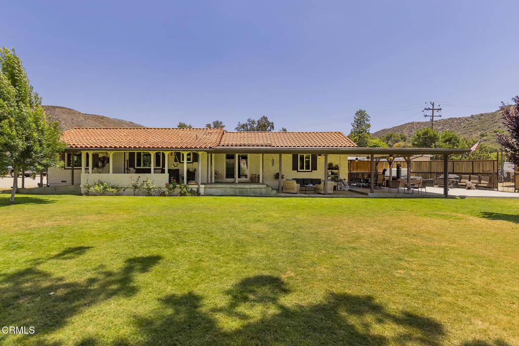 Incredible 3-acre turnkey horse property located in scenic Texas Canyon with direct access to riding trails in the Los Angeles National Forest. The adobe-style main house features 2 bedrooms and 2 bathrooms with rustic charm and modern upgrades. A fully renovated 2-bedroom, 2-bathroom guest house offers stylish accommodations for guests, rental income, or extended family. Equestrian amenities include a professional team roping arena with a calf lane, return alley, arena lighting, and a full sprinkler system for dust control. The property also features 12 large shaded open-air stalls, a hot walker, wash rack, hay barn, and a secure container saddle house. Additional highlights include a new roof (2023), Generac whole-house generator, a strong-producing well with 10,000-gallon water storage, four RV hookups with electric and water, and one septic dump. Relax and entertain under the oversized covered patio with ceiling fans, enjoy the hot tub and outdoor shower, and take in the beauty of mature shade trees throughout the property. Private, peaceful, and fully equipped--this property is ideal for horse lovers and outdoor enthusiasts alike.