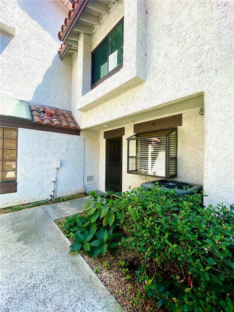 Located in the gated & private, tropical and serene setting of Placentia Lakes is this CLEAN, CLEAN, CLEAN and ready for you to move into Townhome! This home enjoys one of the best locations with in the community and furthest away from the train tracks with plenty of extra parking nearby in addition to it's 1 Car Garage (Carport Style) with Storage Cabinet. Permit parking is available for a second car. New, Neutral, Interior Paint and Capet. Remodeled Bath Rooms, Guest Bath located downstairs (1/2 Bath), Full Bathroom upstairs. LVP Flooring in the Dining and Living Room, which features a cozy Fireplace. Newer Baseboards. Spacious Primary and Second Bedrooms feature vaulted ceilings. Primary Bedroom features a nice Balcony. Oak Cabinets and Tile Counter Tops Oak and newer Appliances, includes a Stainless Steel Refrigerator. A open Patio features views of the meandering streams and lush vegetation and can be viewed through the 8 foot Living Room Slider Doors. Separate Laundry Room off Patio with Newer Washer & Dryer is also included. It's a mere distance to the Community Pools and Tennis Courts. Easy access to freeways, shopping, schools and entertainment. HOA dues is paid by Housing Provider, Tenant pays for all other utilities. No pets, no smoking, in, on or around premises. Renters Insurance required. All applications are submitted through the RentSpree link, no exceptions. Fee for Tenant Screening paid directly to RentSpree. PLEASE DO NOT REQUEST AN APPLICATION OR MAKE AN INQUIRY THROUGH ZILLOW!