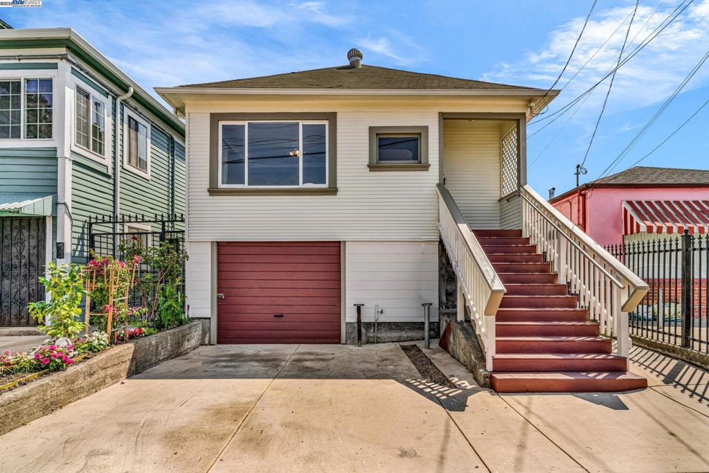 This 2-bedroom, 1-bath home sits elevated above the street, giving it a welcoming presence. Inside, recent updates include interior paint, new flooring in the bedrooms, kitchen, and hall, modern light fixtures, water filter, updated switches and outlets, new baseboards, door hardware, and refreshed kitchen cabinet hardware. Dual-pane windows and a tankless water heater add comfort and efficiency, while the exterior has been refreshed with new paint on the walls, trim, and stairs. The garage is located beneath the main living area, with a large basement that includes a shower—offering ample storage or the potential to be converted into additional living space. Conveniently close to BART, this home offers an excellent commuter location with room to grow.