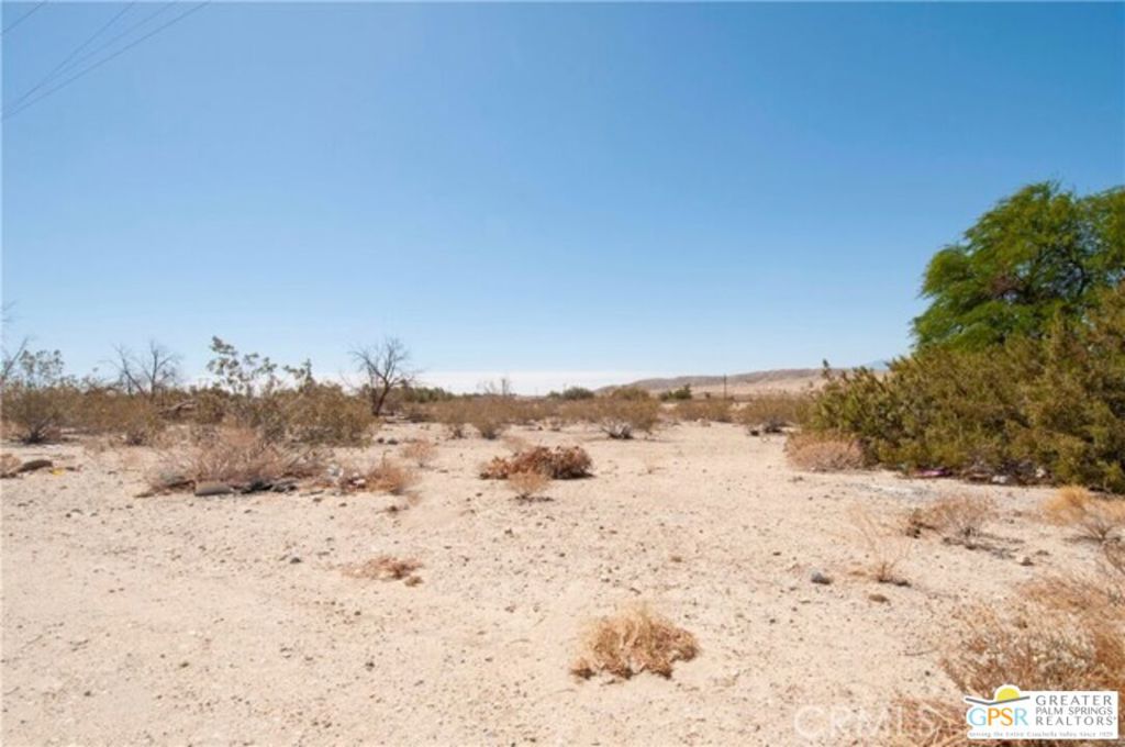 This is a great opportunity. Huge 2.5 acre lot that can be divided into two. Lot has so much possibilities. Water and Electric there. Great Mountain views. Make an offer today!!!