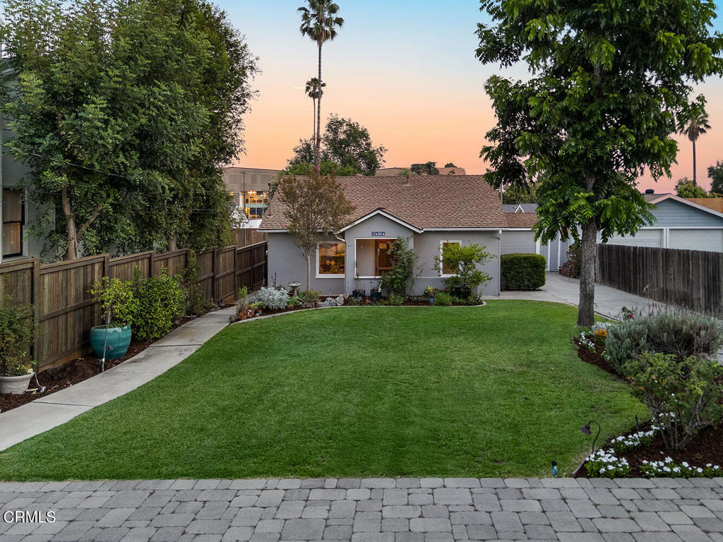Lovingly maintained by the same family for nearly 40 years, this charming cottage-style home is nestled on a quiet street in Northeast Pasadena and offers a rare combination of comfort, thoughtful updates, and outdoor serenity. Set on an expansive lot, the home features original hardwood floors, owned solar panels, updated windows, and a remodeled chef's kitchen with high-end stainless-steel appliances. There are three bedrooms and two bathrooms including a primary suite large enough for a king size bed and an ensuite bathroom with double-vanity. The hall bath is elegantly remodeled and well-appointed with a steam shower. Step outside to a private backyard retreat where enchanting evenings unfold beneath a pergola draped in fragrant wisteria. Unwind in the above-ground spa, gather around the cozy fire pit, or enjoy the soothing sounds of the tranquil water feature. Entertaining is effortless with a natural gas BBQ and a stately stone patio, ideal for large gatherings. Additional conveniences include a dedicated storage room and two paver-lined parking spaces off of the driveway. All this, just minutes from popular restaurants and everyday essentials, makes this home a rare find in coveted Northeast Pasadena.