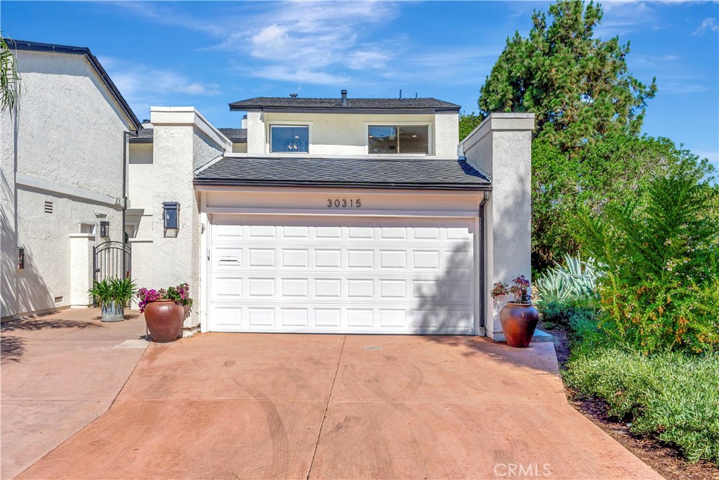 Welcome to 30315 Via Corona, nestled in the charming community of Laguna Niguel, CA. This beautifully upgraded end unit offers privacy and scenic views, making it a smart choice for discerning buyers seeking both comfort and style. Step inside to experience a sophisticated living space adorned with custom tile throughout and all-new flooring and baseboards. The newly custom-tile fireplace is a standout feature, providing a cozy yet elegant ambiance. The home boasts three spacious bedrooms and two and a half fully remodeled bathrooms, each featuring new tubs, vanities, countertops, and toilets, giving them a sleek, modern feel. The heart of the home, the kitchen, has been completely transformed with new cabinets, striking quartz countertops, and a stylish tile backsplash. Enjoy the convenience of top-of-the-line new appliances, including a stove, dishwasher, and microwave. Recessed LED can lighting highlights the freshly painted interior, creating a vibrant and inviting atmosphere. This home also features a new furnace and AC system, ensuring year-round comfort, along with a new water heater and comprehensive re-piping completed in 2022, which comes with a lifetime warranty for peace of mind. The attached garage is not just functional but also newly painted and upgraded with an epoxy floor, adding a touch of class and practicality. New light and plumbing fixtures have been thoughtfully added throughout the home, enhancing its overall appeal. Discover the perfect blend of luxury and tranquility at 30315 Via Corona, where every detail has been meticulously crafted for a superior living experience.