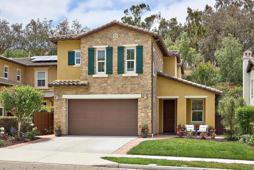 Seller will entertain offers between $1788,800 - $1,888,800. Elegant La Costa Greens Living | Private Greenbelt Setting | Award-Winning Schools. Welcome to your sanctuary in the heart of La Costa Greens — a beautifully maintained 3-bedroom, 2.5-bath home offering 2,448 sq ft of sophisticated living, built by Warmington Homes in 2009. From the moment you step inside, you’ll be impressed by the timeless design, the freshly painted interior and the brand-new Berber carpet. The spacious kitchen is designed for both everyday living and entertaining, featuring a central prep island with breakfast bar seating, modern appliances, and ample cabinetry for storage. Gather around the cozy stone fireplace in the family room or enjoy the convenience of the downstairs laundry room and attached 2-car garage. Upstairs, the generous owner's suite is a private retreat with a serene, west facing balcony overlooking a lush greenbelt, a spa-inspired bathroom with soaking tub, separate shower, dual sinks, and a walk-in closet. Two additional bedrooms share a well-appointed Jack & Jill bathroom, while the built-in desk/command center in the hallway offers the perfect space for homework, remote work, or household organization. Step outside to your private backyard oasis with gorgeous paver stone patio—perfect for morning coffee or evening entertaining—all with the backdrop of lush greenery, offering privacy and a connection to nature. Residents enjoy full access to the exclusive La Costa Greens Presidio Club with resort-style amenities including a sparkling pool and spa with cabanas, fitness center, event clubhouse with kitchen and patio, tennis courts, parks, and a scenic pond with a tranquil waterfall. All of this within the coveted Carlsbad Unified School District, close to world-class golf, fine dining, upscale shopping, and just out of the marine layer—so you can enjoy more sunshine year-round. This is more than a home—it’s a lifestyle. Don’t miss your chance to live in one of North County’s most desirable communities.