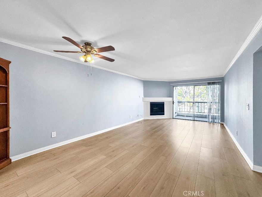 Welcome to this inviting 2-bedroom, 2-bath condo located at 5500 Owensmouth Avenue in Woodland Hills. This updated unit features an open layout with a spacious living room, cozy fireplace, and a private balcony perfect for relaxing. The home includes fresh paint, a new stove, a Fisher & Paykel refrigerator, and a well-designed kitchen with stainless steel appliances, granite countertops, and ample cabinet space. The primary suite offers mirrored closet doors and an en-suite bathroom with dual sinks and a tub/shower combo, while a convenient in-unit laundry area adds everyday practicality. Residents enjoy resort-style amenities including a sparkling pool, lush landscaping, and convenient parking, all within close proximity to shopping, dining, and entertainment.