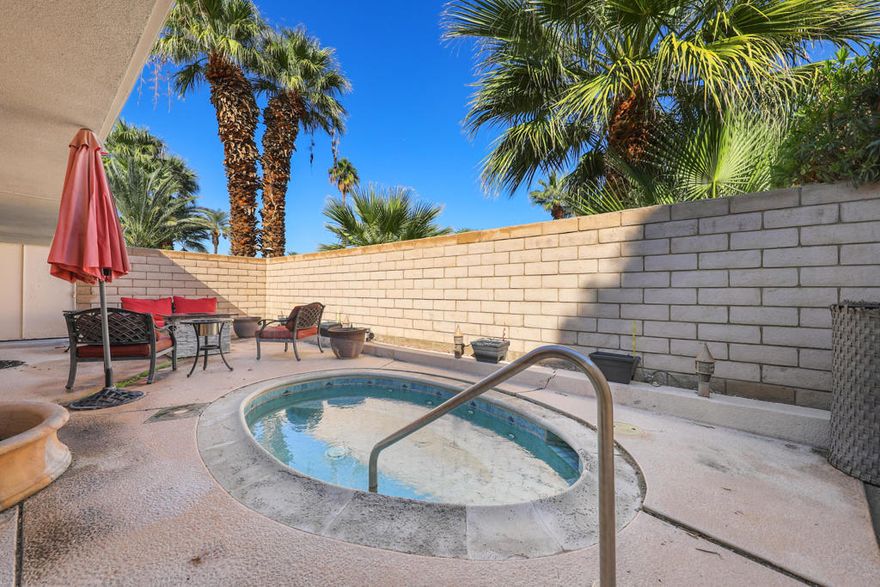 Rare Mid-Century Find!!   A Wexler-Harrison design in 24-hour guard gated Bermuda Dunes Country Club.  Located in The Colonies, a 26-unit condo development built along the first fairway.   Sleek lines, open spaces and indoor-outdoor living at its best.  Expanded 1868 sq.ft.,  2 bedroom,  2 bathroom condo on a private corner lot with wrap-around patio leading to a PRIVATE spa in the enclosed front courtyard.   Discover an airy living and dining space wrapped in dramatic floor to ceiling walls of glass, framing postcard views of the SOUTHERN mountains and a Texas-sized community pool.   The layout flows effortlessly from the open gourmet kitchen, complete with a wine frig, and upgraded cabinets/counters, to a spacious GREAT ROOM, with a stunning Palos Verdes Stone sunken fireplace.   This home is the perfect blend of Mid-Century design and modern luxury offering today's most sought-after upgrades, even an enclosed laundry room.  There is convenient off-street parking plus a one-car garage.   This sophisticated retreat is truly a one-of-a-kind, which includes furnishings (less artwork, personal items and some designer pieces).   Bermuda Dunes Country Club is the ultimate gated community with world-class golfing and just minutes to:  the Indian Wells Tennis Garden,  El Paseo, Medical facilities and easy access to the I-10 Freeway for quick travel to the Acrisure Arena and the Palm Springs Airport!!!    IID for lower electric.HOA of $630 a month includes two community pools, gardening,  water,  trash, and insurance (bare wall coverage).  BD Security of $214 a month includes cable TV with two boxes with Cinemax/Showtime/HBO and internet with Spectrum, plus 24-hour guard gated security.