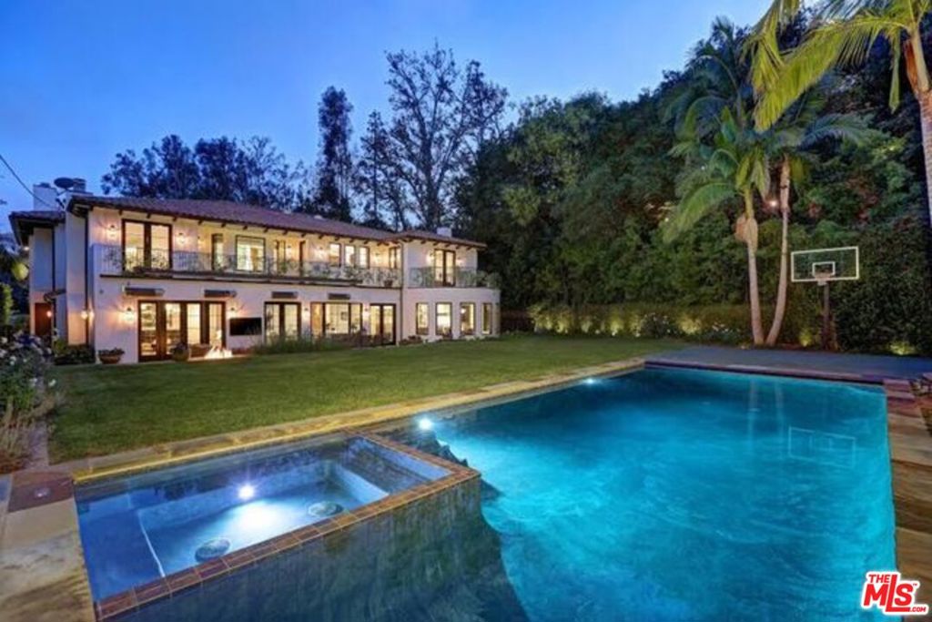 Available mid August 2025. Custom built and beautifully designed with the finest materials, this exquisite five bedroom, six bathroom Mediterranean home is located at the end of a cul-de-sac in a prestigious Brentwood neighborhood. Home provides excellent privacy on a desirable flat lot over 13,700 square-feet with a large back yard with pool providing residents with a seamless indoor-outdoor experience for entertaining. Formal entry leads to the great room which opens up to a chef's dream kitchen. The main level also offers a formal dining room, bar/lounge sitting room, staff bedroom, and a full gym, basketball court and resort-style pool. The upstairs level offers four generously sized bedrooms including a luxurious master suite with separate sitting room and office with massive walk-in closet and an impressive master bath. Home also features state of the art indoor and outdoor sound system. This smart home also has a generator for the whole house.
