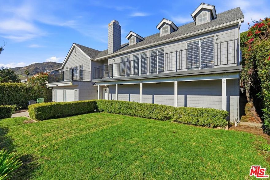 Located in the prestigious and highly sought after Broad Beach neighborhood, this ocean view Cape Cod style home offers the ultimate Malibu lifestyle with steps to the beach and private beach access on the Ocean side of Pacific Coast Highway. Located on a quiet cul-de-sac directly across from scenic Sea Level Beach, the property delivers a rare blend of privacy, coastal charm, and everyday convenience for surfing, strolling , and biking along Broad Beach Road. This 4-bedroom, 3-bath residence features a bright, open floor plan with vaulted ceilings, wide-plank wood floors, and a fireplace-anchored living room that opens to a large balcony with ocean views, ideal for morning coffee or sunset entertaining. The open concept kitchen flows seamlessly into the dining and family areas, creating an inviting space for both daily living and hosting.The spacious primary suite serves as a private retreat, complete with its own ocean view balcony, walk in closet, and en-suite bath with soaking tub and walk-in shower. Three additional bedrooms offer flexibility for family, guests, or a home office. Enjoy outdoor living with a grassy front yard and fenced backyard, perfect for relaxing and entertaining. An oversized two car garage with additional storage provides convenience and functionality. Centrally located near Malibu High School, Malibu Junior High School, and nearby elementary schools on Morning View Drive, as well as private schools close by. Just minutes from Trancas Country Market, Starbucks, grocery stores, boutique shopping, and top rated restaurants. A rare opportunity to own in one of Malibu's most desirable beachside communities.