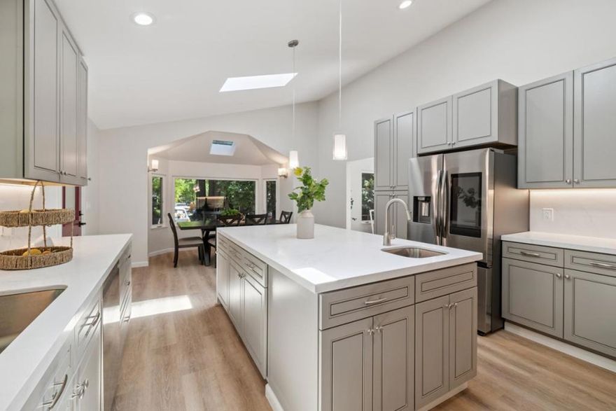 At $999,000 this Boulder Creek charmer is a deal with a kitchen that steals the show. The gourmet kitchen is a chefs dream with gleaming quartz countertops, custom soft-close cabinetry, a large center island and new stainless-steel smart appliances. Designed for both beauty and function, it is the heart of this modern two-story home. Quietly tucked at the end of a private lane, the 2,133-sq-ft residence offers a rare blend of privacy, luxury and natural beauty. With four spacious bedrooms and three bathrooms its perfect for families, guests, remote workers or anyone seeking room to breathe and unwind. Vaulted ceilings and abundant skylights bathe the interior in natural light, while a dedicated laundry with new stackable washer and dryer adds everyday ease. Living flows seamlessly outdoors to a 1,525-sq-ft redwood deck perched above year-round Bear Creek. A beloved feature Is the deck overlooking the creek. Whether sipping morning coffee, practicing yoga or hosting evening gatherings, the serene forest setting delivers unmatched peace and privacy. All on just over half an acre, minutes from downtown Boulder Creek yet worlds away in its tranquil redwood sanctuary. A fully equipped smart home designed for remote monitoring, it blends todays technology with timeless natural beauty.
