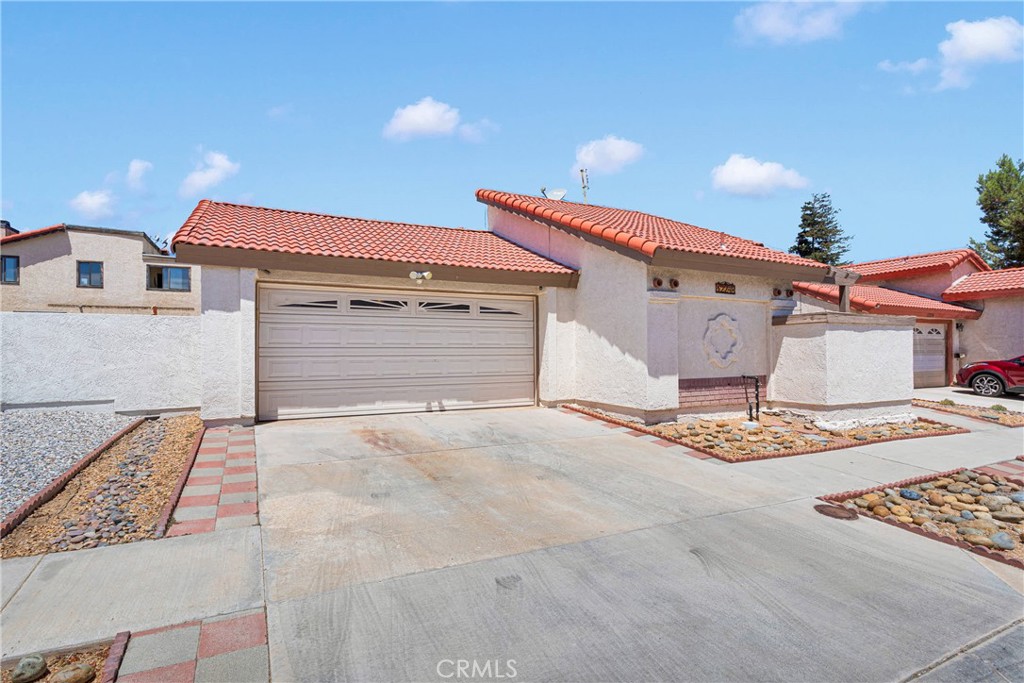 Welcome to your dream home in Victorville, California! This charming three-bedroom, two-bath split floor plan offers both comfort and style. As you enter, you’ll be greeted by a spacious living area that flows seamlessly into the kitchen, perfect for entertaining. The master suite provides a private retreat, while the two additional bedrooms are generously sized. Step outside to discover a beautifully landscaped yard, ideal for outdoor gatherings, and a lovely patio where you can relax and enjoy the serene surroundings. Don't miss the opportunity to make this stunning property your own!