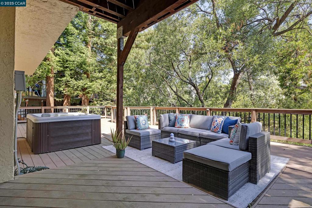Tucked away on a quiet cul-de-sac and framed by a lush backdrop of mature trees, this 3-bed, 2.5-bath, appx. 2079 square foot two-story single-family home is a private retreat just minutes from the Contra Costa Country Club Golf Course. Step outside to not one, but two Trex decks, which are perfect for morning coffee surrounded by nature or evenings unwinding in your private jacuzzi under the stars. On the main level, natural light pours through the skylights and expansive picture windows, framing mature oaks and a seasonal creek. The heart of the home—a beautifully updated kitchen- offers the ideal blend of modern style and everyday functionality, ready to inspire your inner chef. Downstairs, you will love relaxing in the ample-sized primary bedroom retreat, which offers access to the back deck, a spa-like bath, a large walk-in closet and a convenient utility/laundry room with plenty of space for storage. Live near Hidden Lakes Park, Paso Nogal Dog Park, Diablo Valley College, shopping, excellent public schools, and freeways. Whether you're entertaining on the deck or enjoying a quiet moment with nature, this home offers a lifestyle that’s both connected and serene.