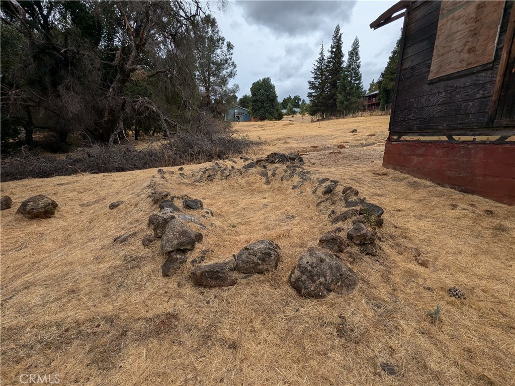 Flat & buildable half-acre lot . The property had a home previously that burned down. Foundation is still present. Water meter, and electricity are on site. Septic was installed but may need to be replaced. Ready to build your future home in a great area. Drive by and take a look. You won't be disappointed.