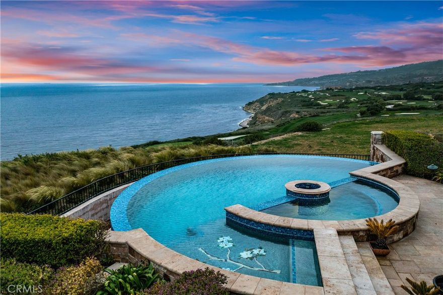 “Villa Cape Point” Set on one of the most iconic stretches of Southern California coastline, this extraordinary estate is the ultimate fusion of land, sea, and architectural vision. Crafted over years by a celebrated developer and designed by renowned architect Louie Tomaro, this is a One-of-a-Kind Architectural Masterpiece located on the Palos Verdes Riviera the Italian Renaissance-inspired villa captures breathtaking, uninterrupted views of the Pacific,Catalina ,Trump National Golf Course, and the dramatic coastline stretching endlessly north and south. Perched privately at the end of a cul-de-sac with approx 300' of view frontage, within a prestigious 24hr guard patrolled enclave. A rare combo of panoramic natural beauty, refined craftsmanship and resort-caliber amenities, all positioned between Beverly Hills and Newport Coast—a coastal setting so unique, it cannot be replicated from Santa Barbara to San Diego.An Iconic Coastal Estate-11,000SF-7 Bd/8.5 Ba Timeless design featuring floor-to-ceiling glass wood incased pocket doors, large ocean terraces.High ceilings, luminous natural light and artisan detailing—from limestone floors, wood ceilings, Schonbek chandeliers and handcrafted onyx baths.The estate includes: A home theater, bar,library , world class wine cellar and tasting room , Executive office,  children’s workspace, a Creston smart-home system, Dual staircases, elevator, 5-car vault and a gated motor court for 10+autos .The resort-style primary suite offers a retreat like no other, with dual walk-in closets, a fireplace lounge, private gym w/ sauna, onyx-clad bath and expansive covered and open air terraces.Resort-Caliber Outdoor Living From the architecturally designed infinity-edge pool and spa to the covered loggias, outdoor kitchen, and lounge decks off nearly every room, the home is designed to embrace the coastal lifestyle at its most luxurious. Hand painted tile fountains and real stone exteriors handcrafted from Italian travertine envelop the property in both substance and style. Private beach paths, ocean trails, and world-class amenities including Terranea Resort lie just moments away. A Trophy Property for the Legacy Collector This is not simply a home—it is a masterwork of vision, execution, and place, visited and admired by some of the country’s top developers. With land, views and architecture, this coastal sanctuary offers a level of craftsmanship and location that cannot be duplicated. For the visionary, the collector, the one.
