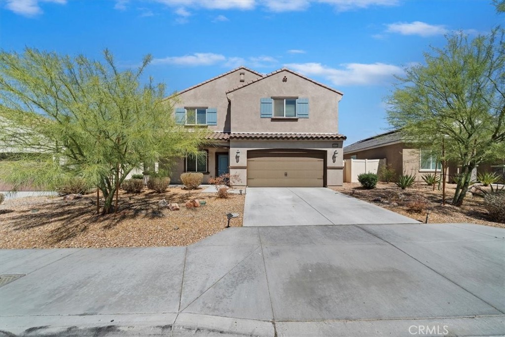 Step into modern comfort and style with this stunning newer built 4-bedroom, 2-bathroom home. Designed with an open-concept layout, the home is filled with natural light and perfect for both everyday living and entertaining. The gourmet kitchen showcases premium stainless steel appliances, granite countertops, and a large center island ideal for gatherings. The spacious primary suite includes a walk-in closet and dual granite vanities for a touch of luxury. Upstairs, a versatile loft offers the perfect space for a home office, playroom, or media area. Enjoy energy efficiency with solar panels, a tankless water heater, and modern HVAC. Ideally located near the 15 Freeway, and just minutes from well-kept parks and a well-managed HOA, this home truly has it all. Don’t miss your chance to make it yours!