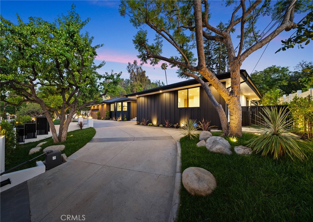 Re-imagined luxurious oasis showcasing unparalleled design and sophistication.
This single level estate is situated on an expansive flat lot of over 17,000 sqft. Set back from the street behind gates with a circular driveway, offers top notch privacy and craftsmanship throughout. Chef's kitchen featuring double islands, chef grade appliances, dual sinks, caesarstone countertops and formal breakfast room. Designer family room with dual sided fireplace finished with floor to ceiling marble and wine display making it a perfect place to host and entertain. Outside you will find a resort inspired private paradise with endless amenities including sparkling pool and spa with waterfall, BBQ area with double island perfect for serving bar, covered patio and lush landscaping. Spacious guest house with full kitchen and bathroom perfect for a home office or teen suite. Luxurious primary bedroom with oversized walk-in closet space and spa-like bathroom also boasting floor to ceiling custom glass built-in cabinetry. All other bedrooms are ensuite and oversized with potential for a second master bedroom. Located within a highly desired South of the Blvd community and just minutes from top rated schools. Home is equipped with a smart system, surround sound and security cameras.